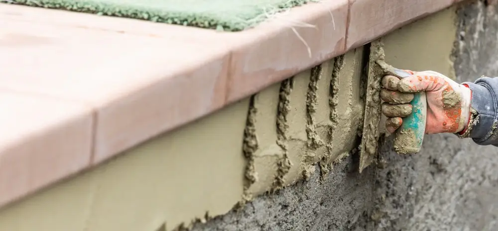 Close-up of concrete pool repairs with precise application of cement for durability