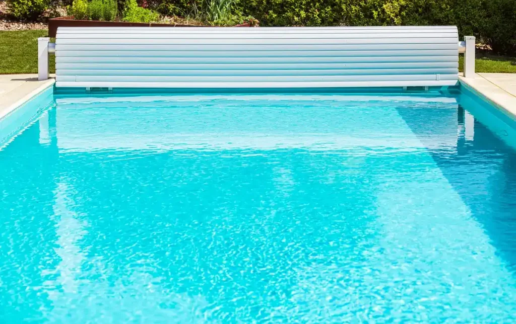 A solar above-ground pool covers on a roller system with a crank for convenient use and water heating benefits.