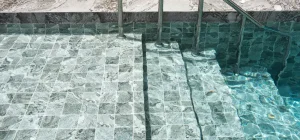 Close-up of fiberglass swimming pool tiles with a sleek and waterproof design.