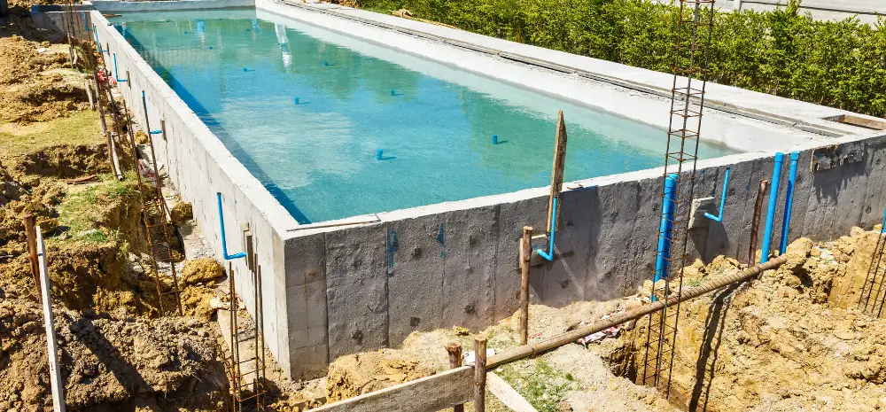 A beautifully installed backyard pool with modern features, completed by a professional pool installer near me.